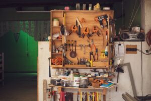 A detailed view of an organized workbench with tools in a traditional Mexican carpentry workshop.
