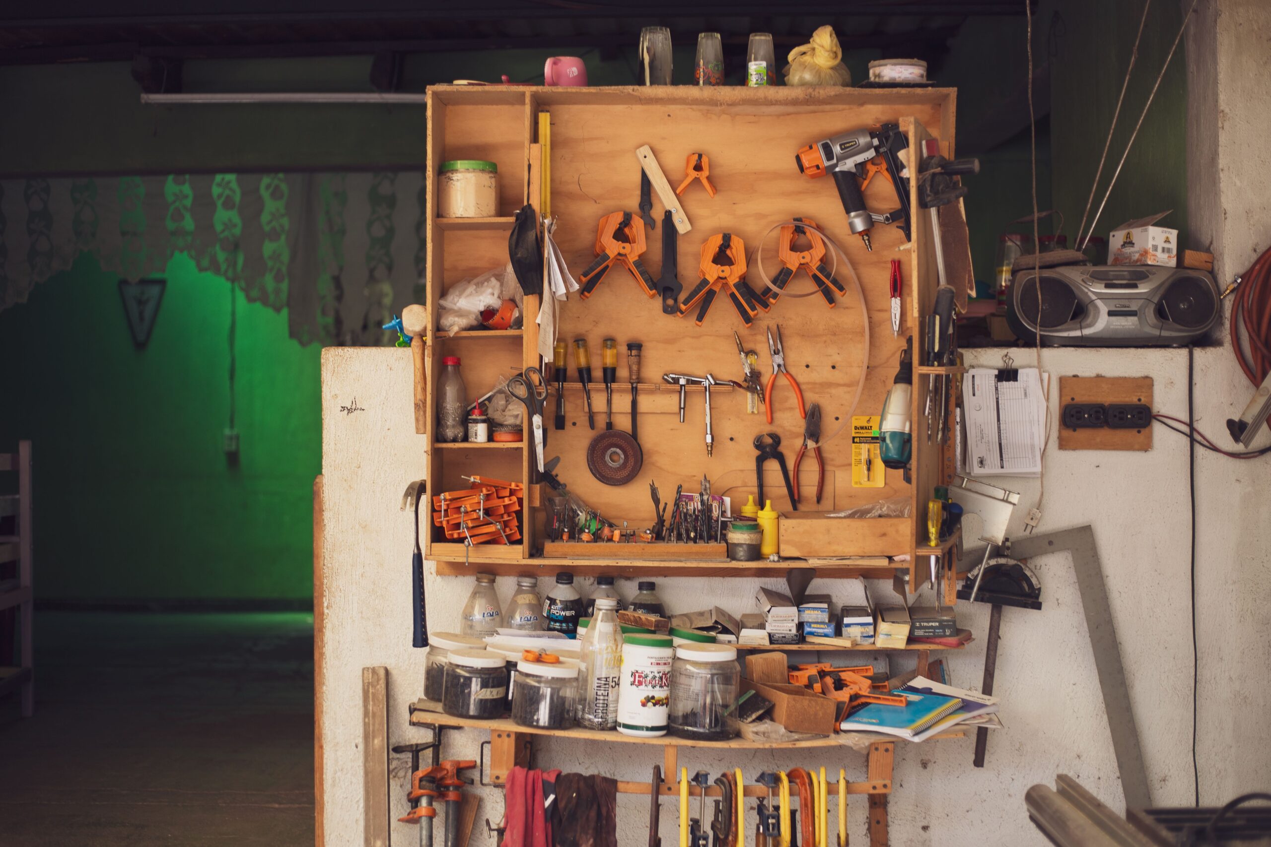 A detailed view of an organized workbench with tools in a traditional Mexican carpentry workshop.